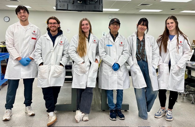 Image of graduate medical students in white lab coats