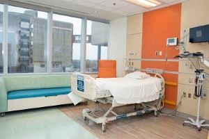 Single patient room with hospital bed