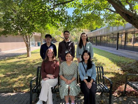 Interns for the 2025–2026 program standing in two rows inside the department lobby